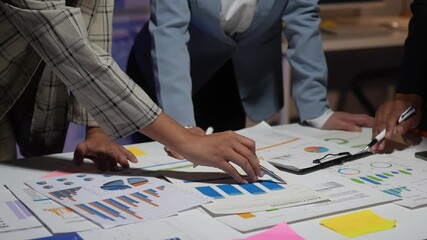 Wall Mural - Business people analyzing financial charts and graphs