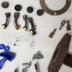 Screws, nuts, bolts and pliers on white background