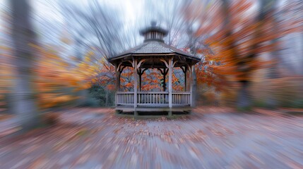 Poster - Blurred autumn park gazebo with softened fall foliage under an overcast sky