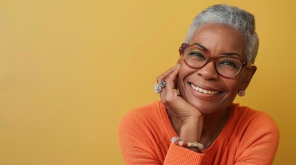 Wall Mural - A woman with glasses and a ring on her finger is smiling