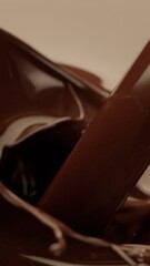 Poster - Super Slow Motion of Splashing Hot Melted Chocolate. Filmed on High Speed Cinema Camera, 1000 fps. Camera in Motion. Extreme Macro Shot.