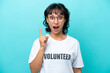 © luismolinero - Young volunteer Argentinian woman isolated on blue background intending to realizes the solution while lifting a finger up