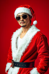 Canvas Print - A man dressed as Santa Claus wearing sunglasses and a red background