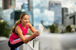 © Minerva Studio - Fitness enthusiast stretching outdoors in the city