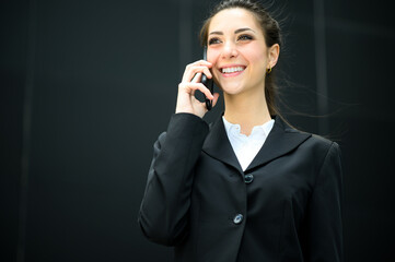 Wall Mural - Portrait of a young woman talking on the phone