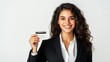 © Kenny - Professional woman smiling holding a credit card in formal attire