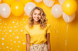 © luismolinero - Young pretty blonde girl over isolated colorful background in a birthday party