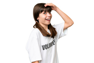 Wall Mural - Little volunteer girl over isolated background doing surprise gesture while looking to the side