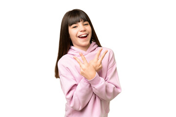 Wall Mural - Little girl over isolated green chroma key background smiling and showing victory sign