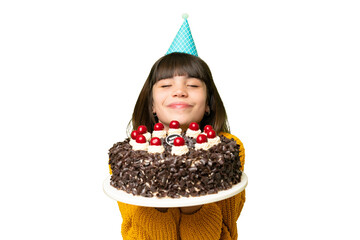 Little girl holding birthday cake over isolated chroma key background