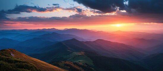 Wall Mural - Stunning Sunset Over Majestic Mountain Range with Vibrant Colors and Dramatic Clouds