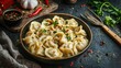 © Valentina - a plate with dumplings on the table. Selective focus