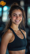 © Michael - Smiling athletic woman in sportswear radiates positivity after her gym workout, embodying a healthy lifestyle and the benefits of exercise for body and mind