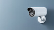 © Quality One   - Minimalist white security camera mounted on plain wall, providing sleek and modern look for surveillance. Ideal for enhancing security in various settings