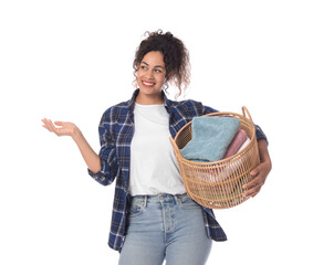 Poster - Happy woman with basket full of laundry on white background