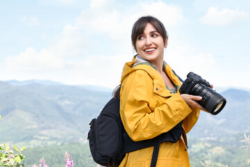 Poster - Photographer with backpack and camera in beautiful mountains