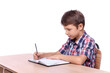 © New Africa - Boy with correct posture and notebook at wooden desk on white background