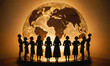 © Miklos - Women stand in silhouette against a large globe, looking up and out, lit by a golden light
