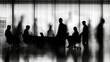 © PRIMPROW - Blurred figures in a conference room, silhouettes of business leaders negotiating a b2b deal, with laptops and documents visible on the table1fbb9a1feb2b