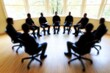 © Prompt2image - Group discussion circle with individuals seated in office chairs, engaged in dialogue in a bright meeting room during daytime
