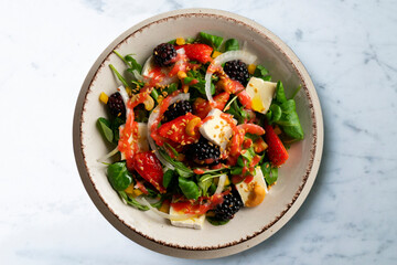 Wall Mural - Healthy red berry and brie salad. Top view table with  decorations.