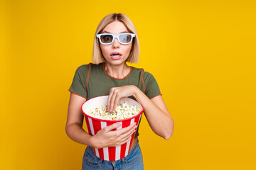 Canvas Print - Photo of speechless girl with bob hair dressed khaki t-shirt in 3d glasses eat pop corn watch thriller isolated on yellow color background