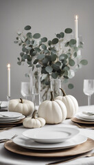 A sophisticated fall table setting featuring a white pumpkin, greenery, and candles. Ideal for autumn gatherings and elegant dinner parties, creating a warm, inviting atmosphere.

