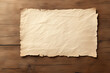 © ChaoticDesignStudio - Blank aged parchment paper on rustic wooden background ready for handwritten notes or decoration