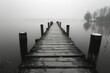 © Graph Squad - A wooden pier with a bridge over a body of water