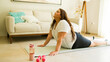 © AntonioDiaz - Attractive woman doing cobra yoga pose in her home and embracing her morning exercise routine