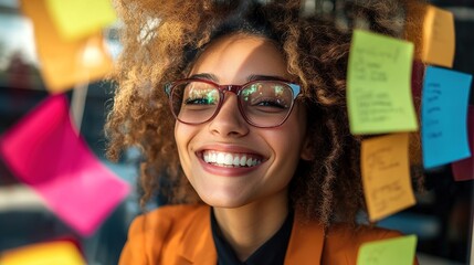 Wall Mural - Cheerful Businesswoman with Sticky Notes at Workspace