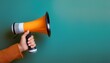© Abdul - Hand holding a megaphone with a plain color background