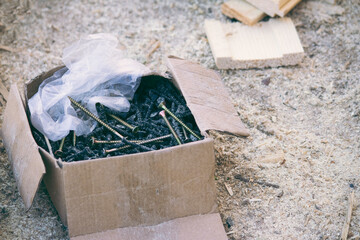 box with screws on a construction site