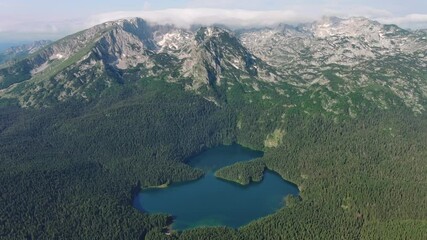 Wall Mural - aerial view of famous black lake in mountain durmitor park at summer, montenegro, 4k