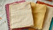 © Collection - A stack of three gridded notebooks with frayed edges, hinting at countless stories and ideas waiting to be explored