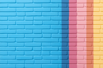 colorful brick wall with blue, pink, and yellow stripes in a bright urban setting during daylight