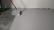 © Ruslan - Construction worker applying epoxy coating on concrete floor using a roller