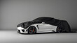© Tark - Presentation sport car under black cloth on gray background. Generative AI