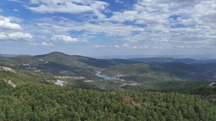 4k Drone Video, aerial  view of mountain peak, cloudy sky and lake overview.