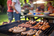 © Hype2Art - Sausages grilling on a barbecue during a summer outdoor party with friends and picnic atmosphere