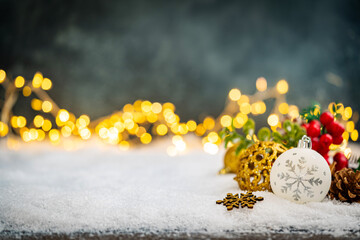 Wall Mural - christmas holiday background with snow, fir tree and decorations with christmas light behind. christ