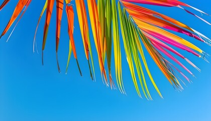 Vibrant Palm Leaves Captured Against a Brilliant Blue Sky