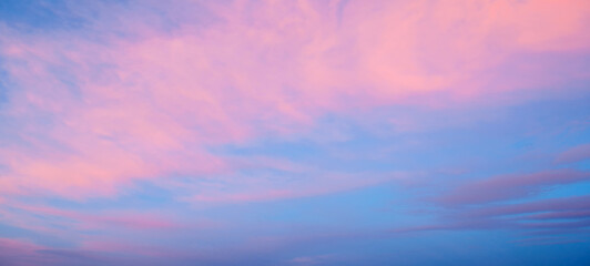Wall Mural - sunset sky background, panoramic view of colorful sunset sky of blue and pink colors. vast sunset sk