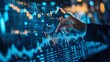 © CinimaticWorks - stock market trends and financial data displayed on blue charts being carefully examined by a business analyst focusing on trade performance, economic growth, and investment opportunities