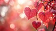 © nikolettamuhari - Red heart-shaped leaves hanging on the branch, against a red and pink...