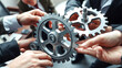 © Christoph Burgstedt - Illustrative conceptual representation of people holding or touching gears with their hands