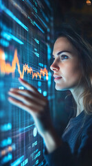 Leinwandbilder - Focused businesswoman analyzing financial data on a large interactive screen with a serious expression