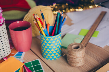 Photo of dressmaking designer desk equipment thread pencil coffee office indoors