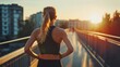 © Khmel - Morning jogger on urban bridge during sunrise in a city