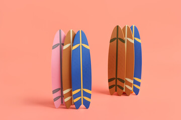 Wall Mural - Different mini surfboards on pink background